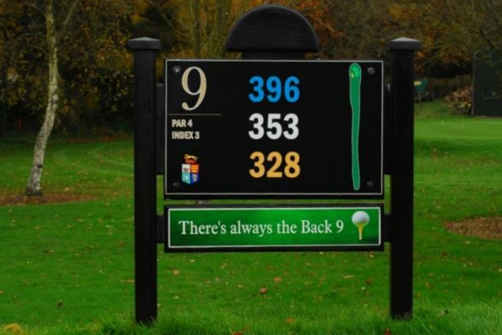 Golf course sign for hole 9 with distances 396, 353, and 328 yards, par 4, index 3, and motivational message.